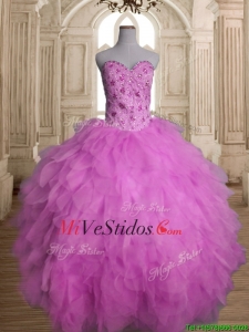 El mejor vestido de tul lila del dulce 16 con listones y volantes