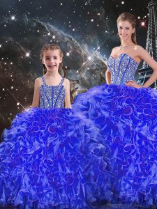 Los vestidos de bola elegantes dulces 16 vestidos azules del organza longitud sin mangas del piso del cordón atan para arriba