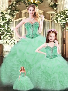 Excelente color verde manzana con cordones, vestido de quinceañera, abalorios y volantes sin mangas hasta el suelo