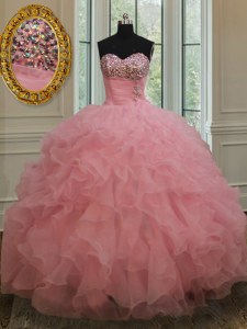 El vestido sin mangas del quinceanera del color de rosa de bebé de los nuevos de la llegada de los cequis de los cequis ata para arriba